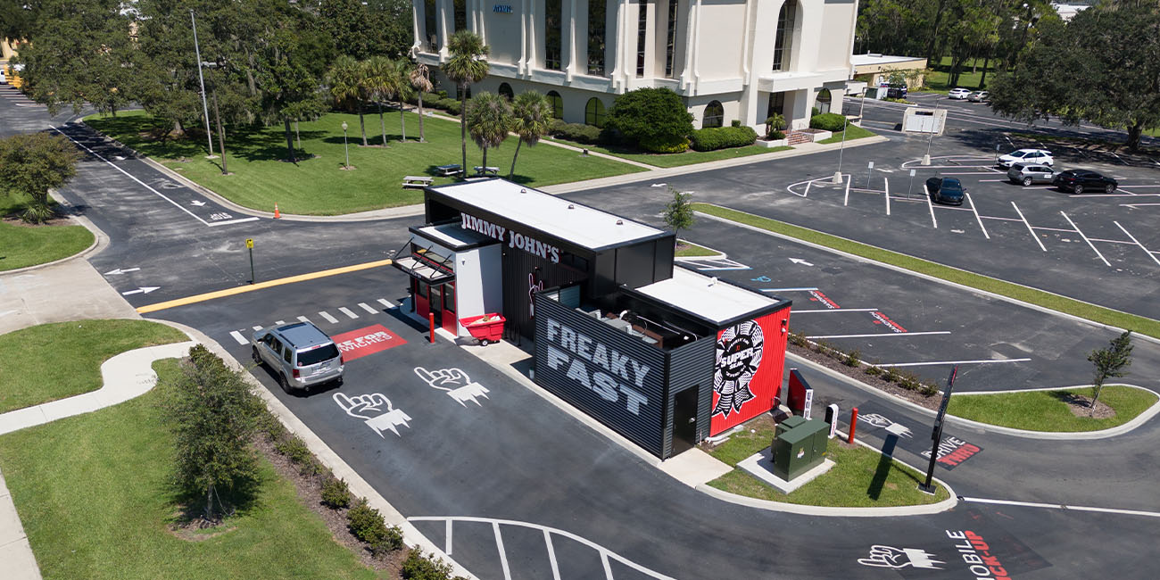 Aerial view of Jimmy John's and parking lot.