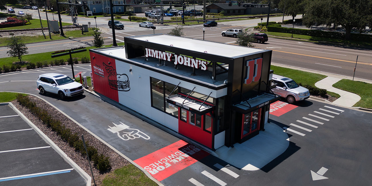 An aerial view of a Jimmy John's restaurant in a parking lot.